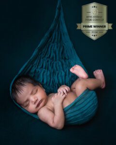AFNS PRIME Platinum Winner newborn boy sleeping in rich emerald hammock